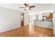 Spacious living room with hardwood floors and views to the bath and kitchen at 6116 Casa Antiqua St, North Las Vegas, NV 89081