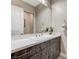 Bathroom featuring a modern vanity with a sink and a large mirror at 6832 Apogee Ridge Ct, Las Vegas, NV 89135