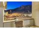 Landscaped front entrance featuring desert plants and a view of the mountains in the background at 6832 Apogee Ridge Ct, Las Vegas, NV 89135