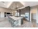 Modern kitchen featuring a large island with seating and stainless steel appliances at 6832 Apogee Ridge Ct, Las Vegas, NV 89135