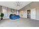 Bright main bedroom with a tray ceiling, large windows, and modern décor at 6832 Apogee Ridge Ct, Las Vegas, NV 89135