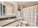 Bathroom with modern vanity, lighted mirror and shower/tub combination at 7344 Jelson Falls St, Las Vegas, NV 89131