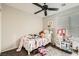 bedroom with carpeted floor, ceiling fan, and large window at 7344 Jelson Falls St, Las Vegas, NV 89131