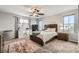 Serene bedroom with natural light, plush carpet, and a spacious layout at 7344 Jelson Falls St, Las Vegas, NV 89131