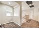 Upstairs hallway with carpeted floor and railing overlooking downstairs at 7344 Jelson Falls St, Las Vegas, NV 89131