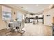 Bright eat-in kitchen featuring white cabinets, stainless appliances, and tile floors at 7344 Jelson Falls St, Las Vegas, NV 89131