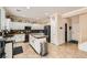 Well-equipped kitchen featuring granite countertops, black appliances and adjacent breakfast area at 7344 Jelson Falls St, Las Vegas, NV 89131