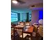 Contemporary dining room with a glass-topped table and modern chairs, creating an ideal space for gatherings at 745 N Royal Crest Cir # 151, Las Vegas, NV 89169