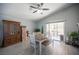 Dining area with a view to the backyard, next to antique cabinet and boxes at 7485 Rainbow Spray Dr, Las Vegas, NV 89131