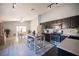 Stylish kitchen with stainless steel appliances and center island, with an adjacent dining area at 7485 Rainbow Spray Dr, Las Vegas, NV 89131