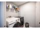 Modern laundry room with side-by-side washer and dryer at 7485 Rainbow Spray Dr, Las Vegas, NV 89131