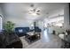 Open living room featuring sleek gray floors and comfortable seating, ideal for relaxation at 7485 Rainbow Spray Dr, Las Vegas, NV 89131