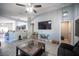 Bright and spacious living room with an open layout and stylish gray wood flooring at 7485 Rainbow Spray Dr, Las Vegas, NV 89131