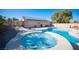 Inviting backyard featuring a refreshing pool and relaxing hot tub for outdoor enjoyment at 7485 Rainbow Spray Dr, Las Vegas, NV 89131