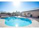 Sparkling pool and spa with desert landscaping in backyard at 7485 Rainbow Spray Dr, Las Vegas, NV 89131