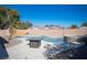 Inviting pool and spa with desert landscaping at 7485 Rainbow Spray Dr, Las Vegas, NV 89131