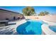 Backyard pool and spa, surrounded by desert landscaping at 7485 Rainbow Spray Dr, Las Vegas, NV 89131