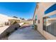 Spacious backyard featuring a patio, rock landscaping, and retaining wall at 7608 Little Valley Ave, Las Vegas, NV 89147