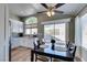 Charming dining area with an arched window and a modern ceiling fan at 7608 Little Valley Ave, Las Vegas, NV 89147