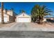 Single-story home with a two-car garage and desert landscaping in a sunny neighborhood at 7608 Little Valley Ave, Las Vegas, NV 89147