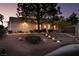 Well-manicured front yard with lighting leading to the home's entrance at 7608 Little Valley Ave, Las Vegas, NV 89147