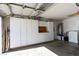 Spacious garage featuring storage cabinets, shelving and overhead lighting at 7608 Little Valley Ave, Las Vegas, NV 89147