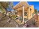 Backyard patio features a covered pergola, built-in bar, desert landscaping, and privacy fence at 7928 Broadwing Dr, North Las Vegas, NV 89084