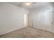 This bedroom features neutral carpet and a ceiling fan with a light at 7928 Broadwing Dr, North Las Vegas, NV 89084