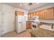 Functional kitchen with stainless appliances, granite countertops and light wood cabinets at 7928 Broadwing Dr, North Las Vegas, NV 89084