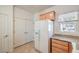 Kitchen featuring stainless steel refrigerator, granite countertops, and convenient storage at 7928 Broadwing Dr, North Las Vegas, NV 89084