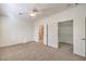 Carpeted main bedroom with ensuite bathroom and walk-in closet at 7928 Broadwing Dr, North Las Vegas, NV 89084