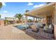 Backyard featuring desert landscaping, a swimming pool, and a covered patio at 8106 Buffalo Clan Ct, Las Vegas, NV 89131