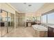 Luxurious bathroom with a soaking tub, dual shower, and elegant finishes at 8106 Buffalo Clan Ct, Las Vegas, NV 89131