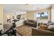 Cozy bedroom featuring a sofa, exercise equipment, and beautiful natural light at 8106 Buffalo Clan Ct, Las Vegas, NV 89131