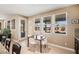 Bright breakfast nook features a view of the backyard through three large windows at 8106 Buffalo Clan Ct, Las Vegas, NV 89131