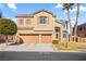 Two-story home with a three-car garage and palm trees in a lush, green neighborhood at 8106 Buffalo Clan Ct, Las Vegas, NV 89131