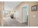 Hallway with plush carpet leading to the various rooms of the home at 8106 Buffalo Clan Ct, Las Vegas, NV 89131