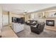 Cozy living room featuring comfortable seating, a fireplace, and a built-in entertainment center at 8106 Buffalo Clan Ct, Las Vegas, NV 89131