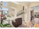 Spacious living room featuring a staircase with decorative wrought iron and an open layout at 8106 Buffalo Clan Ct, Las Vegas, NV 89131