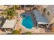 Bright aerial view of the backyard pool, spa, covered patio, and desert landscaping at 8106 Buffalo Clan Ct, Las Vegas, NV 89131