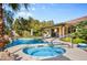 Inviting pool and spa area with a covered patio, perfect for outdoor relaxation and enjoying the backyard oasis at 8145 Mountain Forest Ct, Las Vegas, NV 89129