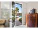 Bedroom view through a glass door looking out to the pool and backyard at 8145 Mountain Forest Ct, Las Vegas, NV 89129