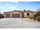 Charming single-story home with a three-car garage, landscaped front yard, and inviting entrance at 8145 Mountain Forest Ct, Las Vegas, NV 89129