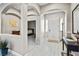 Inviting foyer with an arched ceiling and entry view into an adjacent bedroom at 8145 Mountain Forest Ct, Las Vegas, NV 89129