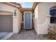 Inviting home entrance with decorative door, sidelights, and a well-maintained walkway and landscaping at 8145 Mountain Forest Ct, Las Vegas, NV 89129