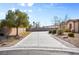 Long driveway leads up to this well-maintained single Gathering home with desert landscaping and mature trees at 8145 Mountain Forest Ct, Las Vegas, NV 89129