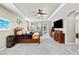 Bright main bedroom with a ceiling fan, pool access, and elegant wood furniture at 8145 Mountain Forest Ct, Las Vegas, NV 89129