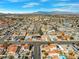 Expansive aerial view of neighborhood with the home centrally located, showcasing a desirable location near mountain views at 8212 Ducharme Ave, Las Vegas, NV 89145