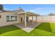 Artificial turf and covered patio enhance the backyard of this well-maintained home at 8212 Ducharme Ave, Las Vegas, NV 89145