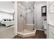 Bathroom featuring a glass enclosed shower, wood-look floor, and toilet at 8212 Ducharme Ave, Las Vegas, NV 89145